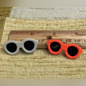 Tony tiny sunglasses pins.